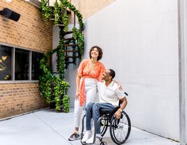 Couple laughing together and hugging outside