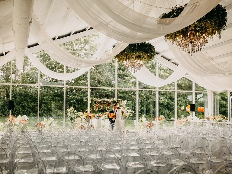An indoor-outdoor ceremony space at Greenhouse Two Rivers in Highlandville, Missouri