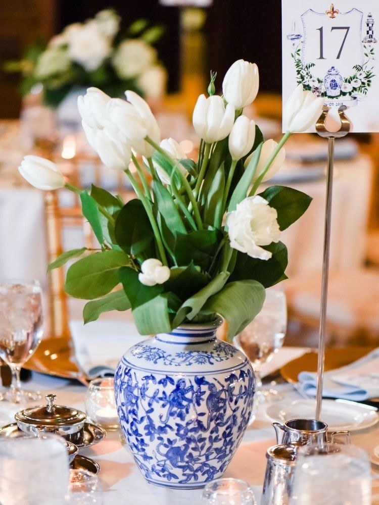 white tulips in chinoiserie vase