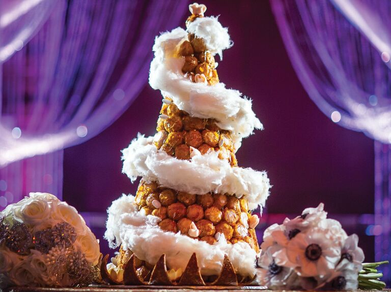 croquembouche wedding cake decorated with cotton candy swirl spiraling down the cake