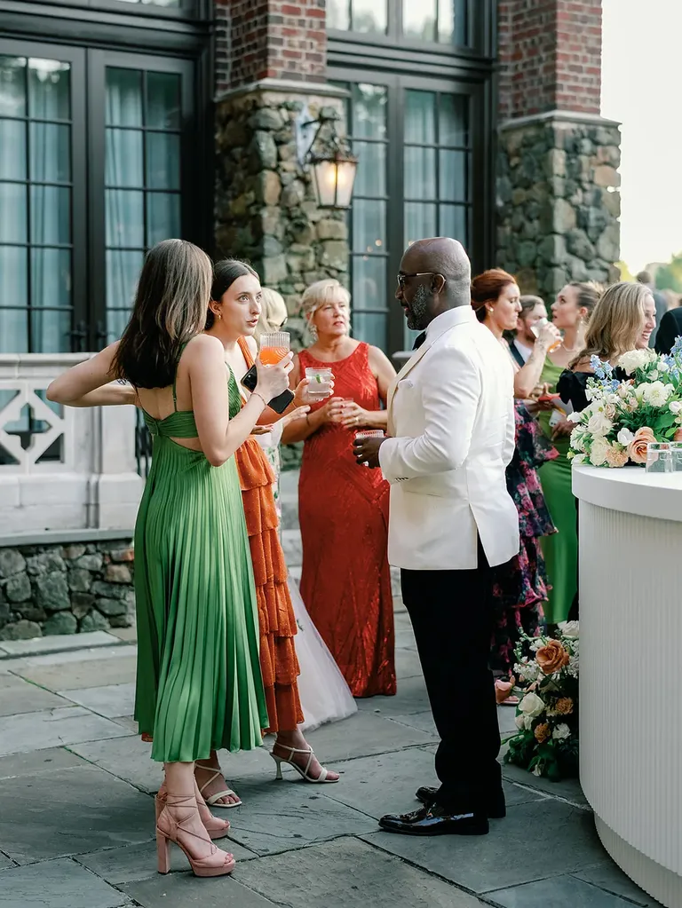 wedding guests in colorful formal cocktail attire