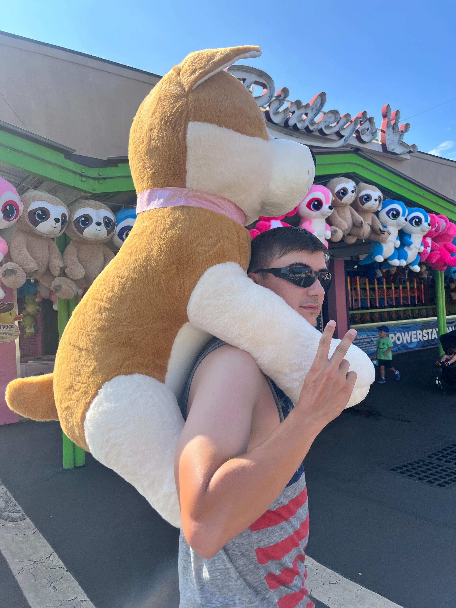 We went to Six Flags together and came home with the biggest prize of all—thankfully, it just barely fit in Alfred’s car! 🐶😂