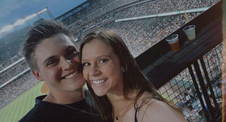 Paige moves to downtown Denver and the city adventures begin! Us at a Rockies game.