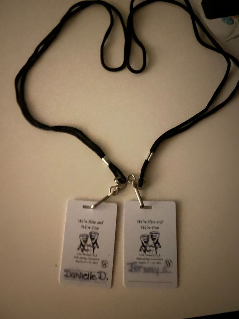 💞Danielle had no idea 📸 Jeremy took this picture, capturing a sweet surprise. These are their convention badges from their time in Palm Springs, California 🌴. The moment was a testament to their bond, filled with unexpected joys and cherished memories 💖.
