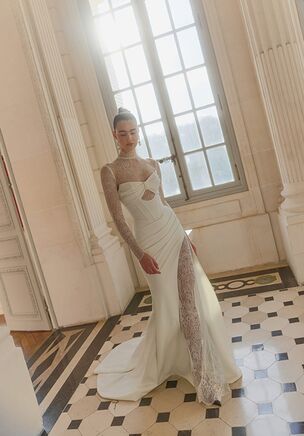 A strapless, sweetheart neckline begins the ivory Herrera gown from the Maison Blanche collection by WONÃ Concept. The slim, floor-length silhouette features Chantilly lace, a deeply dipped open back, and a subtle skirt slit. A removable, long-sleeved, high-neck bolero alters the entire aesthetic. A dramatic bow accents the natural waist, while a clean court train sweeps behind for a memorable exit. Tactile draping and a structured corset style bodice introduce refined surface interest.