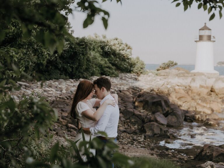Summer engagement photo idea by lighthouse. 