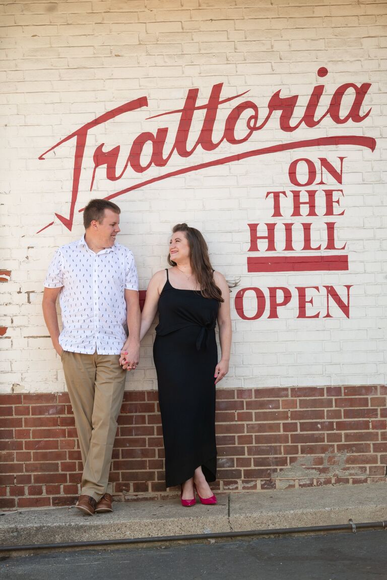 A few days later, Aaron invited her to join him in Little Italy for dinner (the perfect suggestion of course). Surprising no one, Annie was running late to their date, but Aaron let her know there was a parking spot behind Trattoria Restaurant. 
Anyone who has ever been to Cleveland’s Little Italy would understand Annie’s confusion and disbelief when there actually was a parking spot behind the restaurant when she arrived. 
…And then she heard, “Thanks Buddy!” 
Aaron had pre-paid for her spot, and it was the best $10 he ever spent.
The rest of that first date was romantic and magical and all of the good things a first date should be. The fact that Aaron volunteered to help Annie fix her car’s headlights before her upcoming trip to Pittsburgh was just icing on the cake. (Annie would be on her way to be Ashley’s Maid of Honor for a different July 20th wedding!)
Unfortunately for Aaron, replacing the headlights on Annie’s Volkswagen was a tougher job than he expected (2 hours in Allison’s garage in 95 degree heat instead of a 15 minute job). Fortunately for Aaron, Annie knew nothing about cars, or that the job was only supposed to take 15 minutes, because his chivalrous act impressed Annie so much that she never let him go.
They have been inseparable ever since, and not just because they were on rolling quarantine together for the first four months of the pandemic.