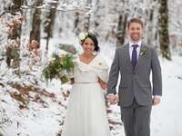 wedding couple walking in snow