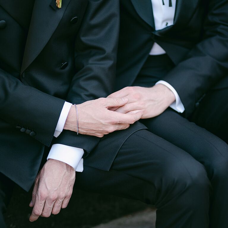 Couple holding hands