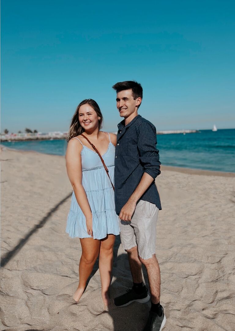 Connor Proposed to Emily on a trip to Barcelona, Spain. Not pictured: the naked beach goers (Connor did not know most European beaches are nude beaches). Photoshop is magical. 