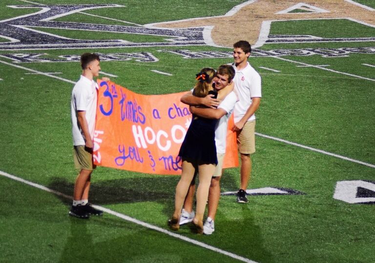 Senior homecoming for Liv and Peyton! This year Peyton asked Olivia by getting on a microphone and unrolling a large poster on the football field during a Varsity game! He never disappoints.