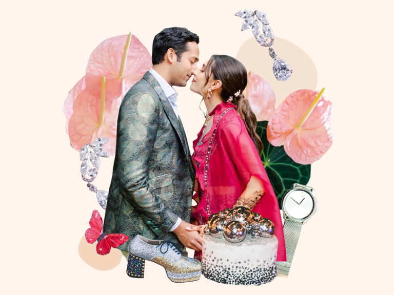 Couple kissing surrounded by colorful glam wedding theme decor