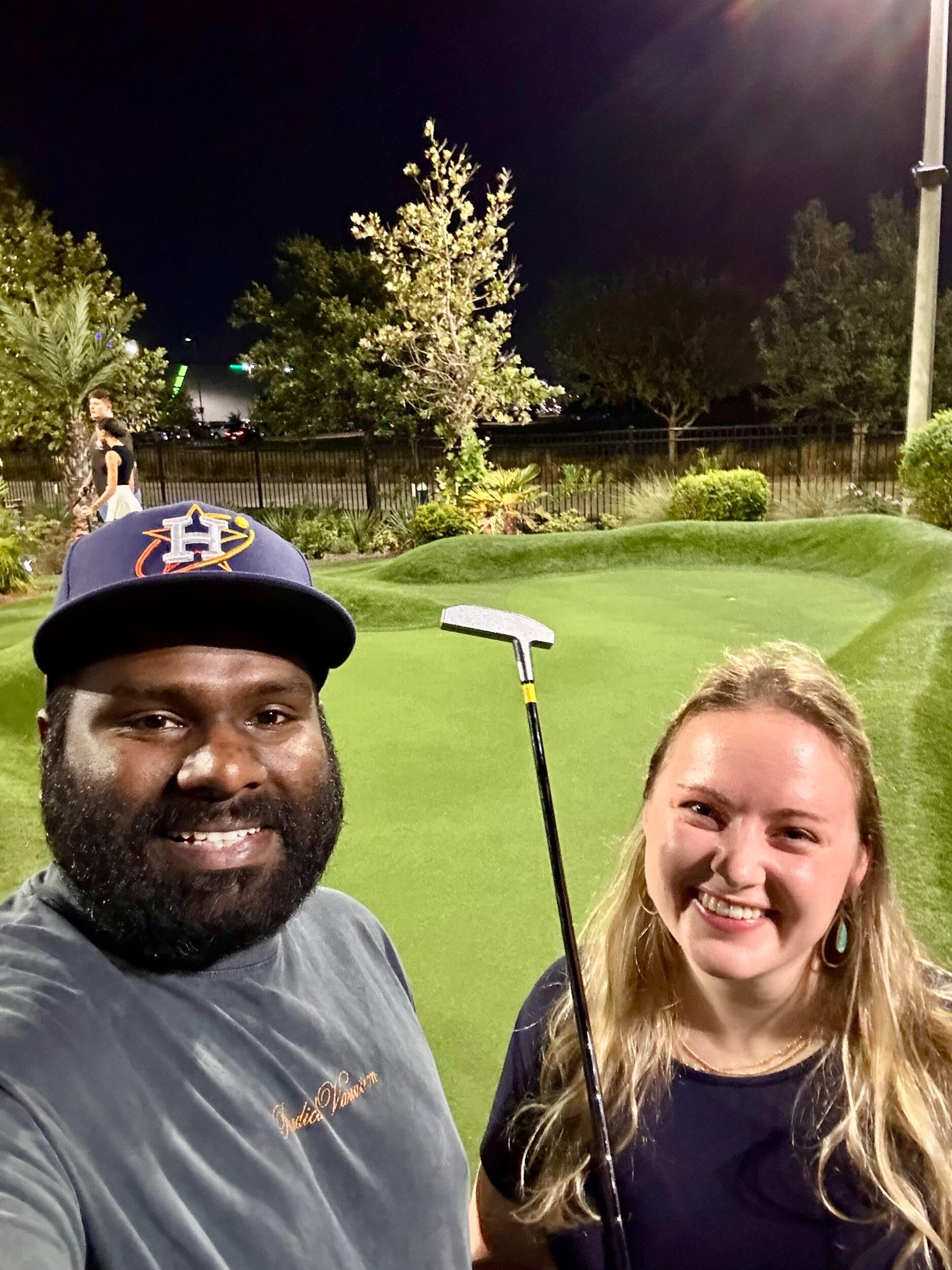 Rahul's first golf lesson to Audrey - the first full round of golf was not long after! 