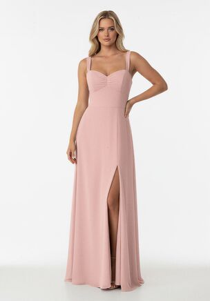 Turn up the style with this fashion-forward bridesmaid dress designed to feel fresh and elevated. Crafted from airy Poly Chiffon, this A-line gown features a ruched top that highlights a flattering sweetheart neckline. Tapered straps add a modern touch, while the ruched top flows into a fitted waist that creates a beautifully defined silhouette. Finished with a softly flowing skirt, this dress blends romantic detail with contemporary elegance for a look that feels effortlessly on trend.