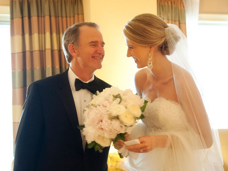 Bride and her father smiling during the wedding day