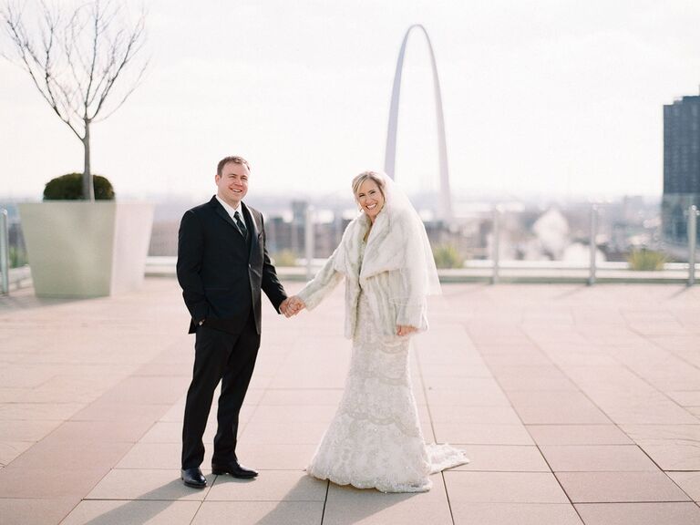 Newlyweds with St. Louis skyline in background