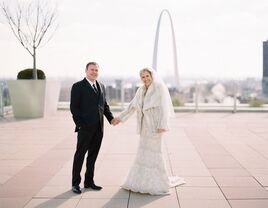 Newlyweds with St. Louis skyline in background