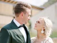 Bride and groom looking at each other during wedding portraits