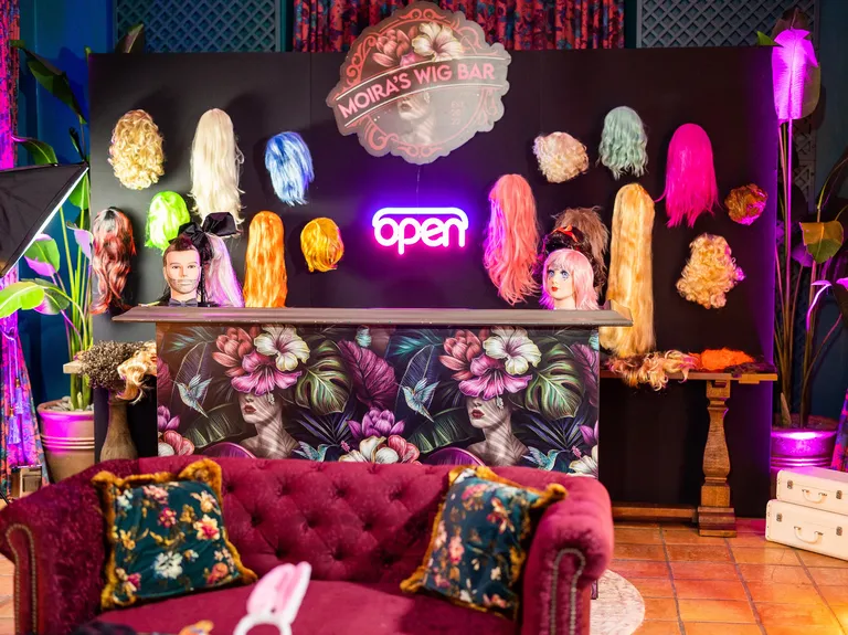 Costume room wedding after party with wall of wigs, taylor swift themed wedding