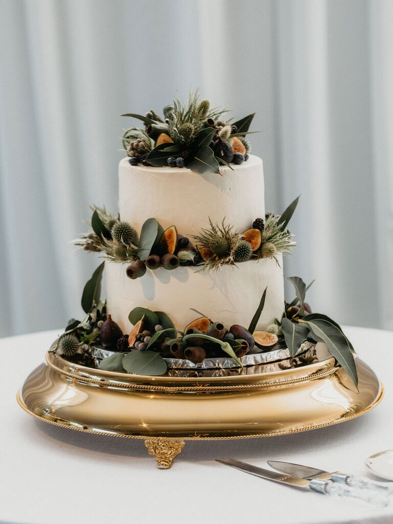 Two-tier white rustic wedding cake with succulent decorations