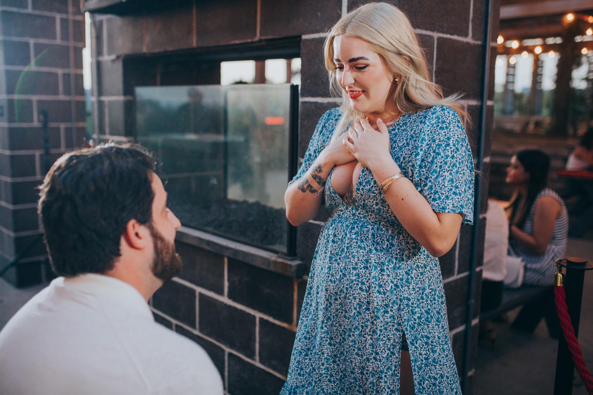 Nathan organized a surprise party for Chloe's 27th birthday back at the bar where they had their first date. It was an extra special surprise when he got down on one knee! Chloe's answer was "Absolutely yes!"