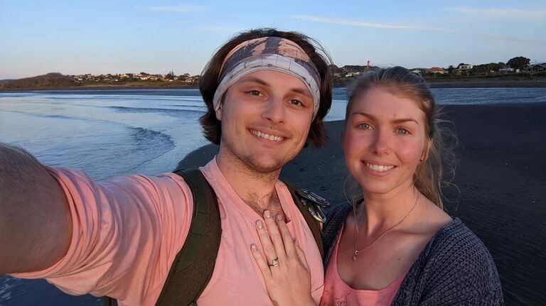 Tyler and Sam having a nice long romantic walk on a beach to celebrate their engagement in NZ!
