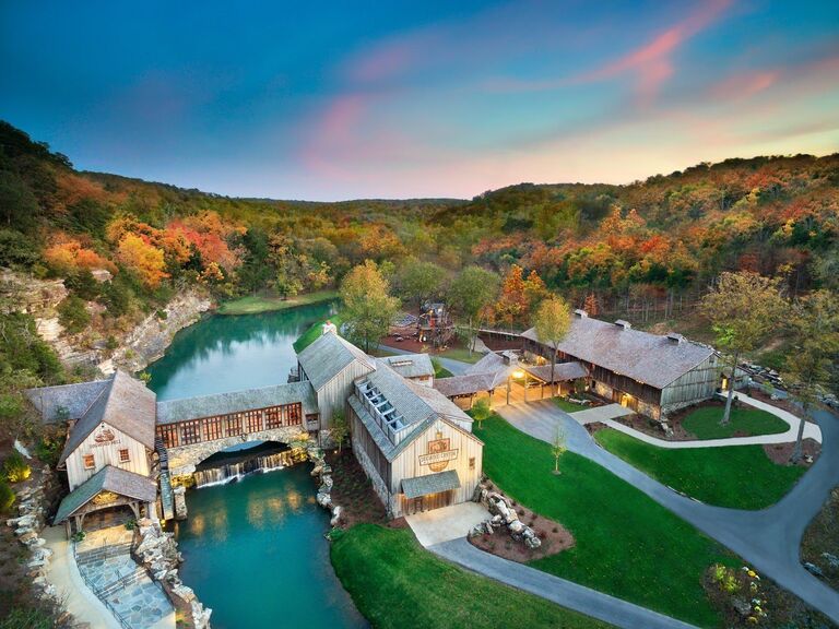 Overview of Dogwood Canyon Nature Preserve and its wooden barns and lake