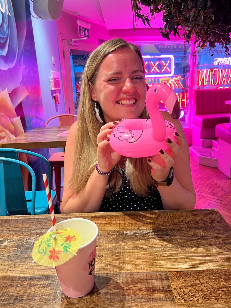 The first photo Matthew ever took of Emily, during their second date.  Sally the Flamingo is still a treasured item within their home, though at this point she has many sisters on the shelf next to her