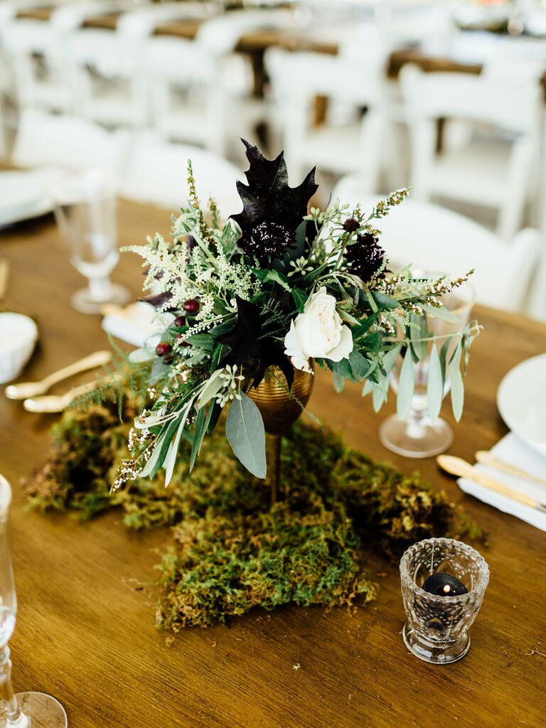Wedding Centerpieces Moss and dark leaves