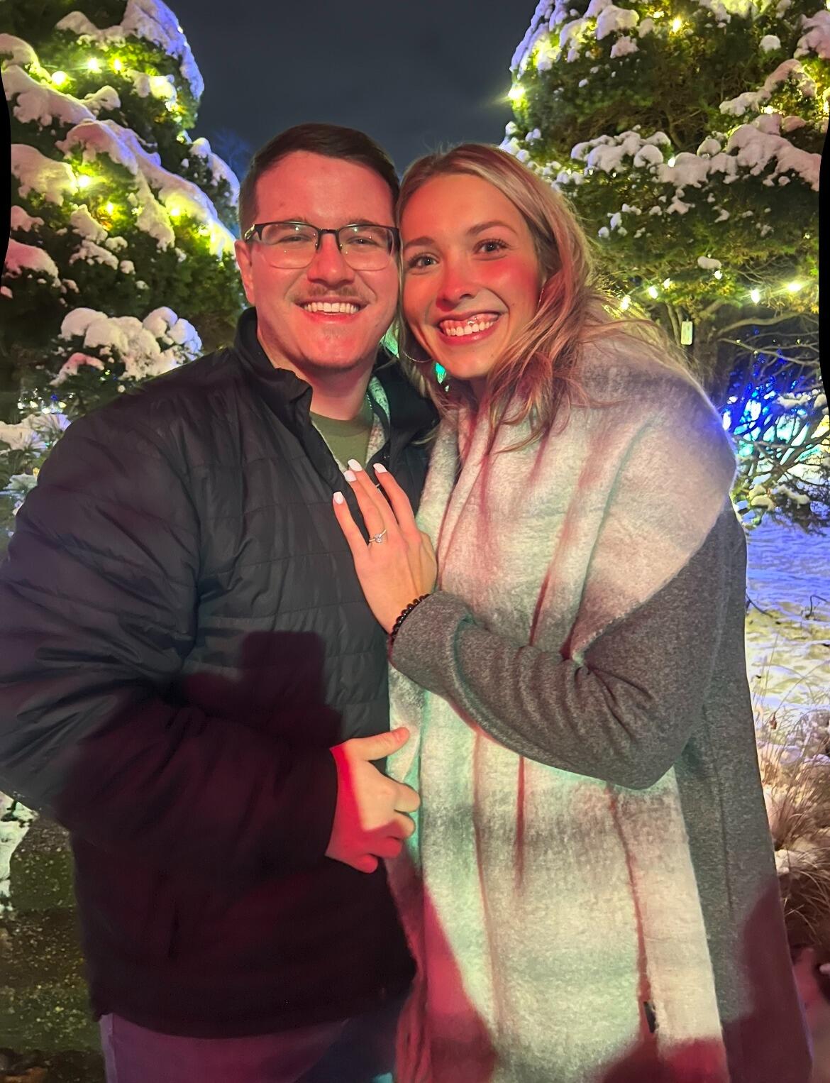 Nate & Haley got engaged at Phipps Conservatory in Pittsburgh. It was a freezing cold night, and Haley was wondering why Nate wanted to keep wandering around the outdoor garden. When he got down on one knee, they had been outside so long, and it was so cold that Haley's tears actually froze to her cheeks. It was such a surprise and so worth the freezing weather! :)