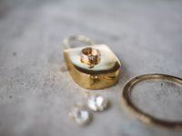 Gold male engagement ring on gold lock