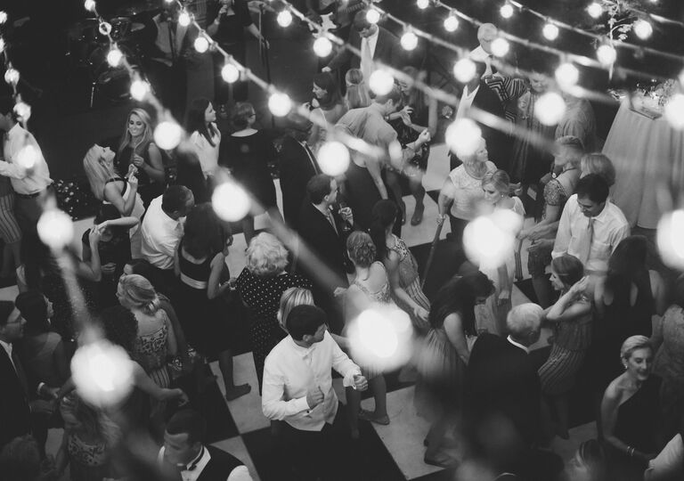 Reception dance floor under string lights