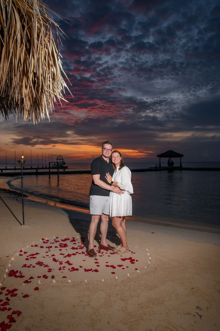 Nathan had organized the trip and set up a photography session and a candlelight dinner for two on the beach. He convinced Emily it was part of a regular resort package - he played it off very well!
