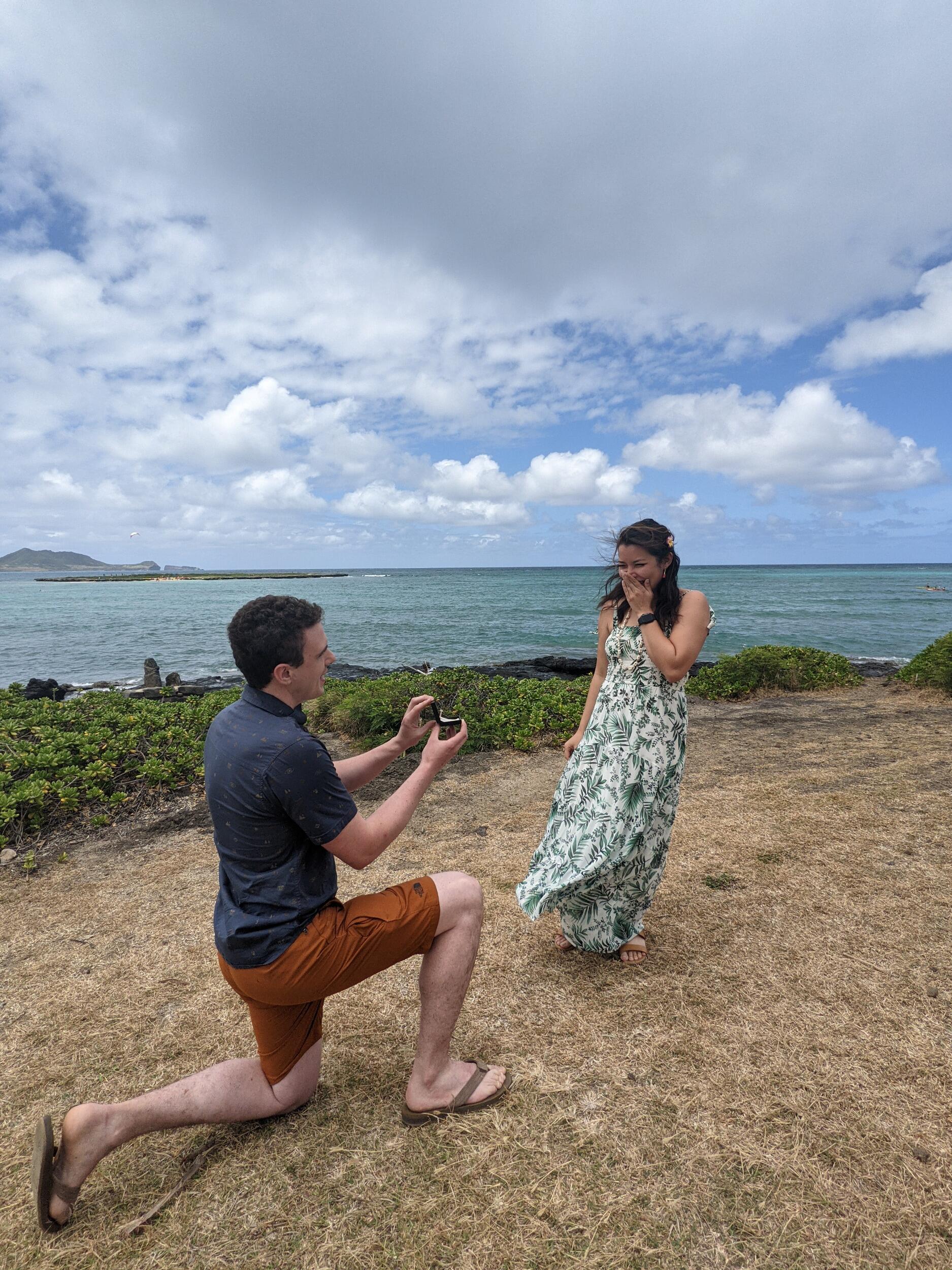 But Joe was ready! When he parked the car at Lanikai beach he saw the spot it was meant to happen. The proposal surprised Olivia on a cliff overlooking Lanikai Beach!