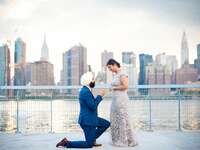 Surprise proposal in front of NYC skyline