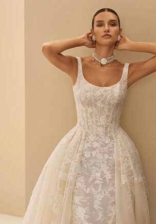 Two-piece mermaid silhouette bridal gown with round neckline, straps, beaded lace, corset back closure and tulle overskirt.