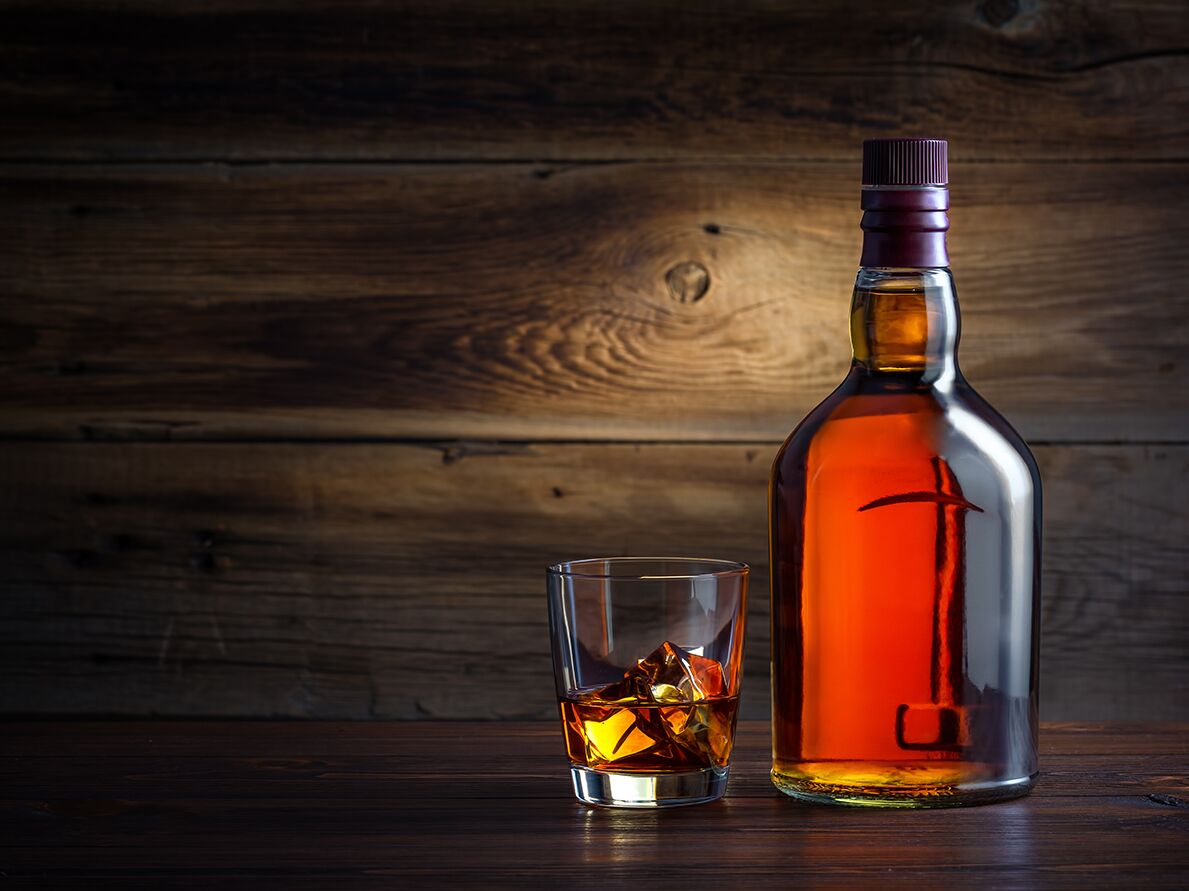 Bourbon bottle and glass