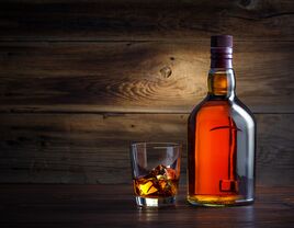 Bourbon bottle and glass