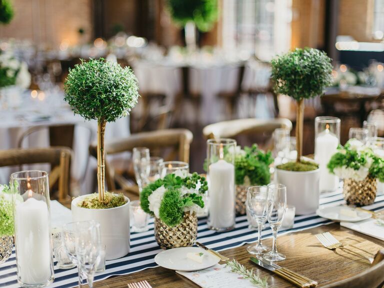 preppy wedding centerpiece with blue and white striped runner and mini green topiaries