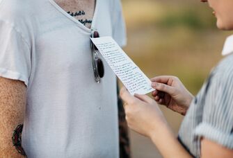 Wife reading love poem to husband