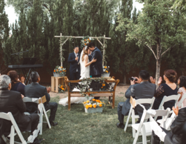 Couple kissing at the altar during wedding ceremony