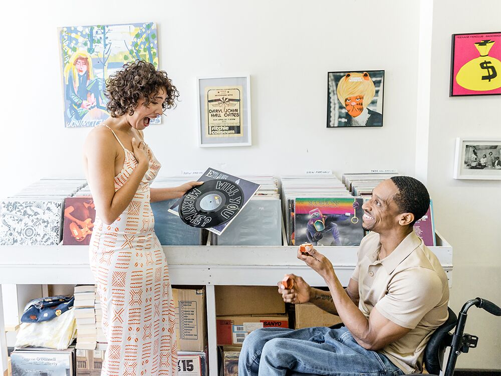 Wedding proposal in vinyl record music store