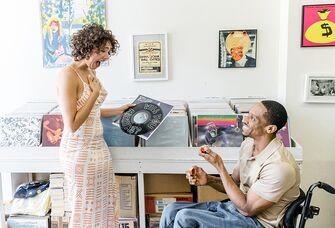 Wedding proposal in vinyl record music store