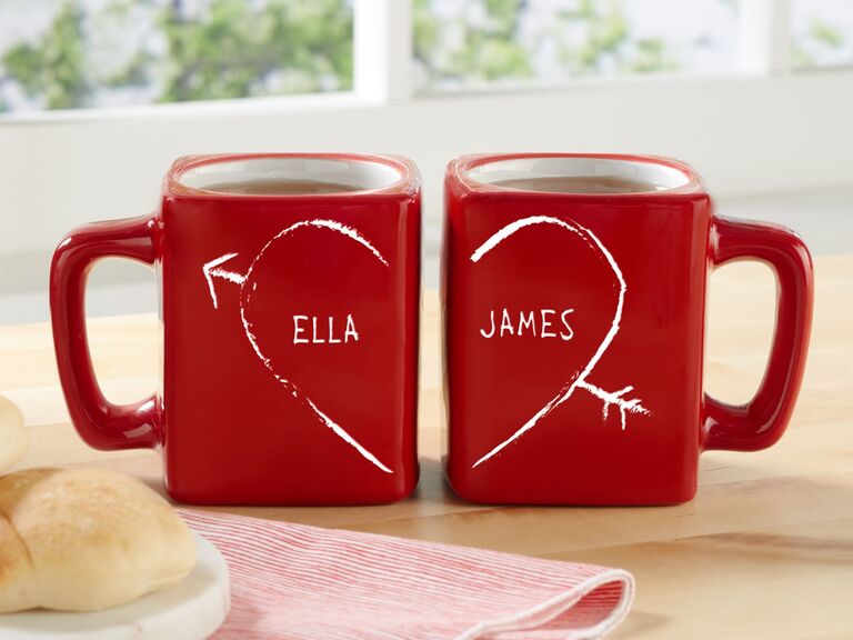 Two red mugs personalized with a couples' names and a heart Etsy wedding gift idea
