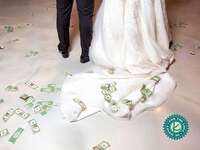 couple with money trailing after the wedding