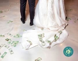 couple with money trailing after the wedding