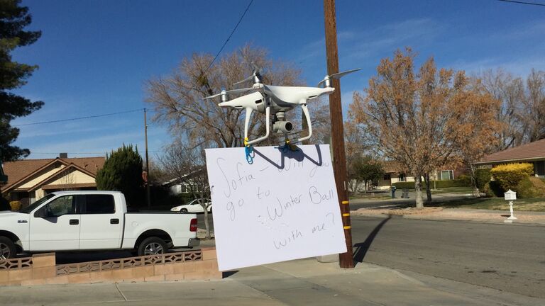 Caleb flying his drone, about to ask Sofia to winter ball