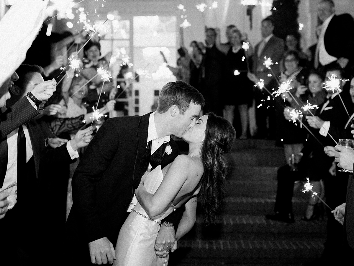 Wedding reception kiss and exit