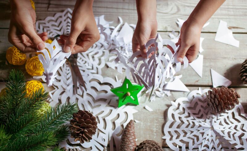 Elf themed Christmas party ideas - paper snowflake decor