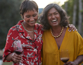 Woman laughing with mother-in-law on walk